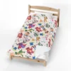 Toy Story fleece blanket in the Character Collage design, spread on a kids bed.