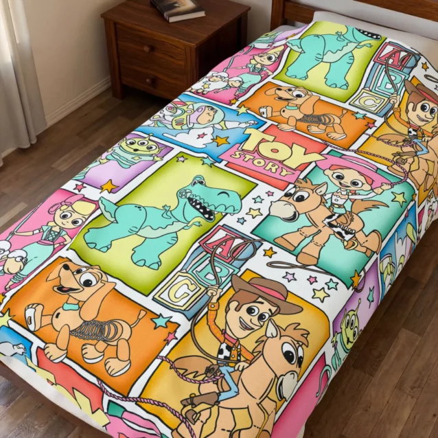 Toy Story throw blanket in the Comic Panel design, styled in a bedroom.