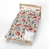 Toy Story fleece blanket in the Jessie Cowgirl design, spread on a kids bed.