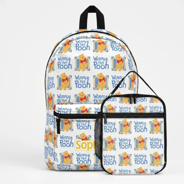 Winnie the Pooh backpack and matching lunch box set in the classic logo print, laid out together.